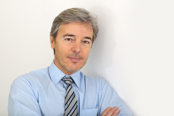 Portrait of mature businessman, isolated