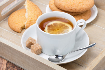 black tea with lemon and cookies