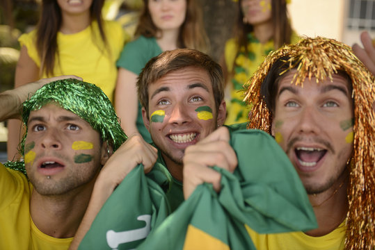 Astonished group of Brazilian sport soccer fans