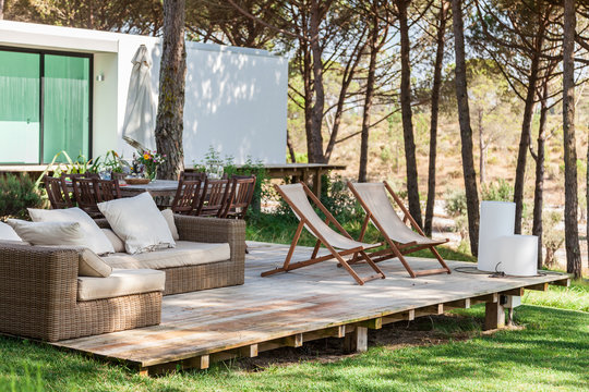 Summer House Deck With Chairs And Sofa