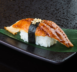 japanese cuisine. sushi unagi on the background