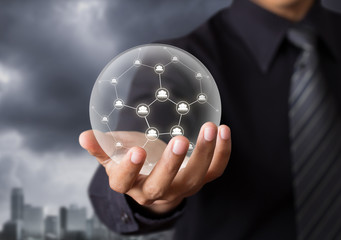 Business people holding social network in crystal ball