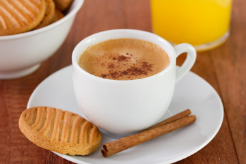 cup of coffee with cookies and orange juice
