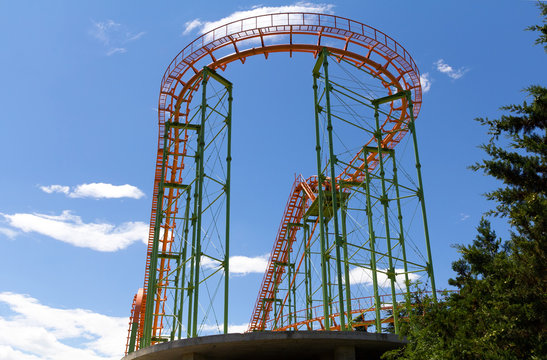 Roller coaster at the background of bright sky