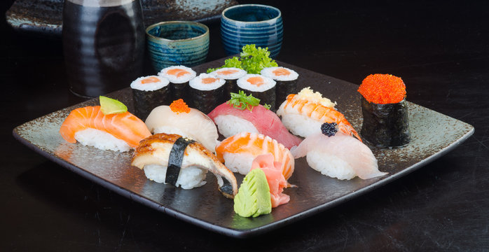 japanese cuisine. sushi set on the background