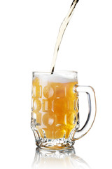 Pour glass of beer isolated on white