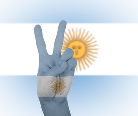 Hand peace sign with flag of Argentina