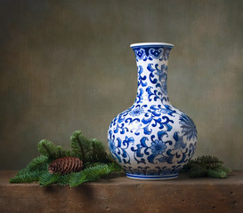 Still life with chinese vase and fir branches