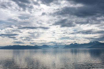 Fjord scene with dramatic cloudy sky