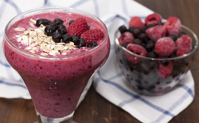 Cocktail of frozen raspberries, blueberries, muesli with yogurt.