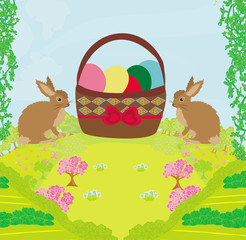 Greeting Card with Easter rabbits and basket with eggs