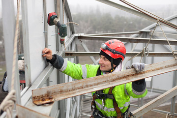 Industrial climber on a metal construction