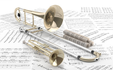 Trombón y Trompeta sobre partituras.