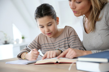 Mom helping kid with homework