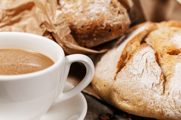 Rustic bread and a cup of milk coffee