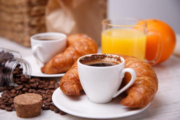 Morning meal with orange juice and croissants