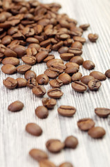 Coffee beans on a wooden background