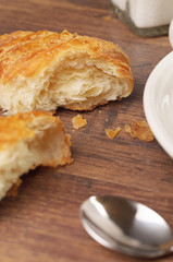 Two pieces of a flaky croissant