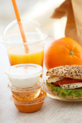 Sesame and poppyseed mozarella bun with sauces and juice