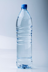A big bottle of water on a gradient background