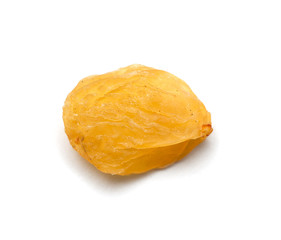 yellow raisins on a white background. macro