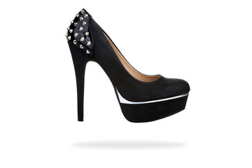 Black platform shoe with studs, isolated on white