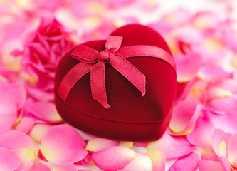 Heart-shaped Gift Box on rose petals