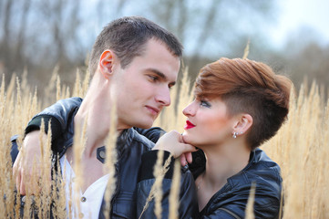 Loving couple on the autumn field