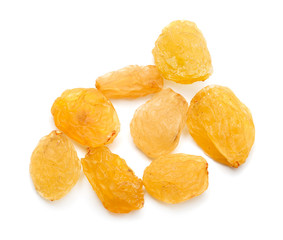 yellow raisins on a white background. macro