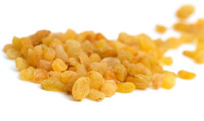 Golden raisins on a white background