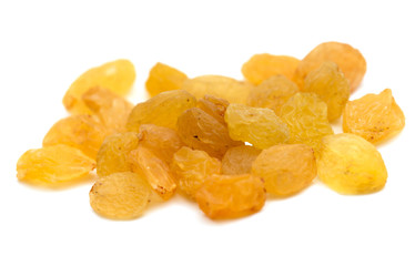 yellow raisins on a white background. macro