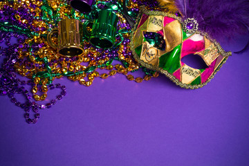 Mardi Gras or Carnivale mask on a purple background
