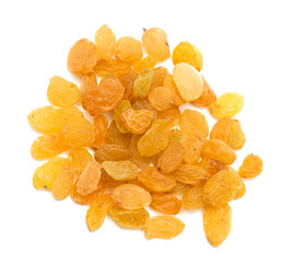 yellow raisins on a white background. macro