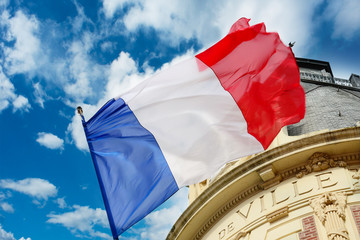 French flag waiving over some Hotel de Ville © connel_design
