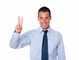 Charming latin man with victory gesture