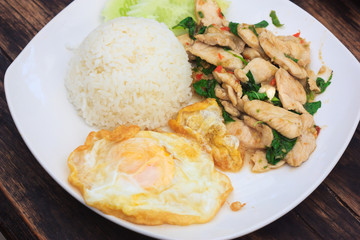 fried basil chicken with fried egg and rice, top view