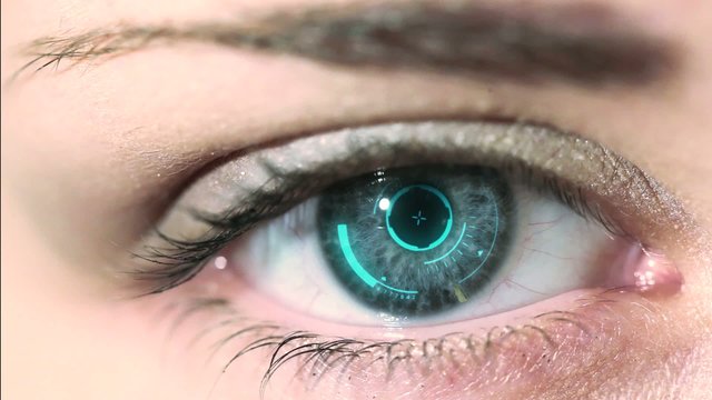 Close up to woman's eyeball with futuristic system.