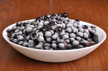 heap of frozen black currant in a plate