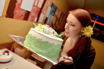 Cheerful woman eating pie