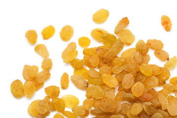 Golden raisins on a white background