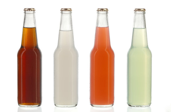 Four assorted soda bottles, alcoholic drinks with water drops