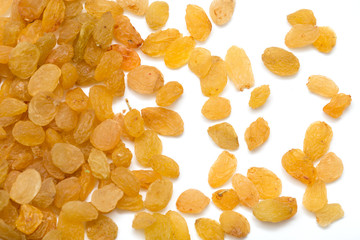 Golden raisins on a white background