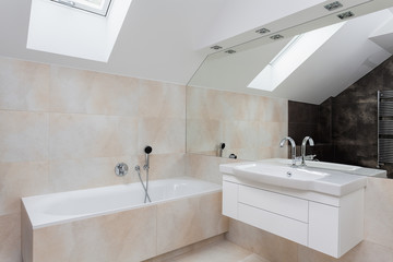 Bath and sink in bathroom