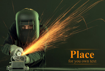 Portrait of workman in black mask on black background