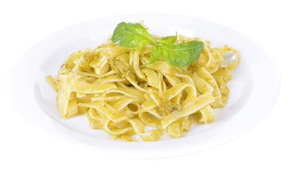 Delicious pasta with pesto on plate isolated on white