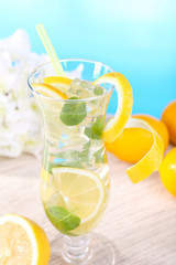 Glass of cocktail with lemon and mint