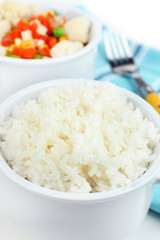 Cooked rice and vegetables close up