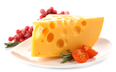 Piece of cheese with grape, tomato and rosemary