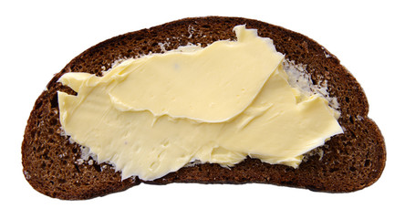 Slice of rye bread with butter, isolated on white