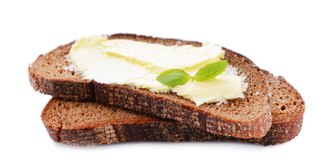 Slices of rye bread with butter, isolated on white
